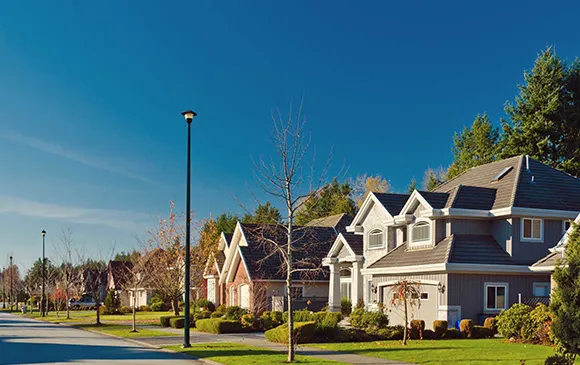 Beautiful street view of residential homes, showing a friendly neighborhood with well-kept houses.